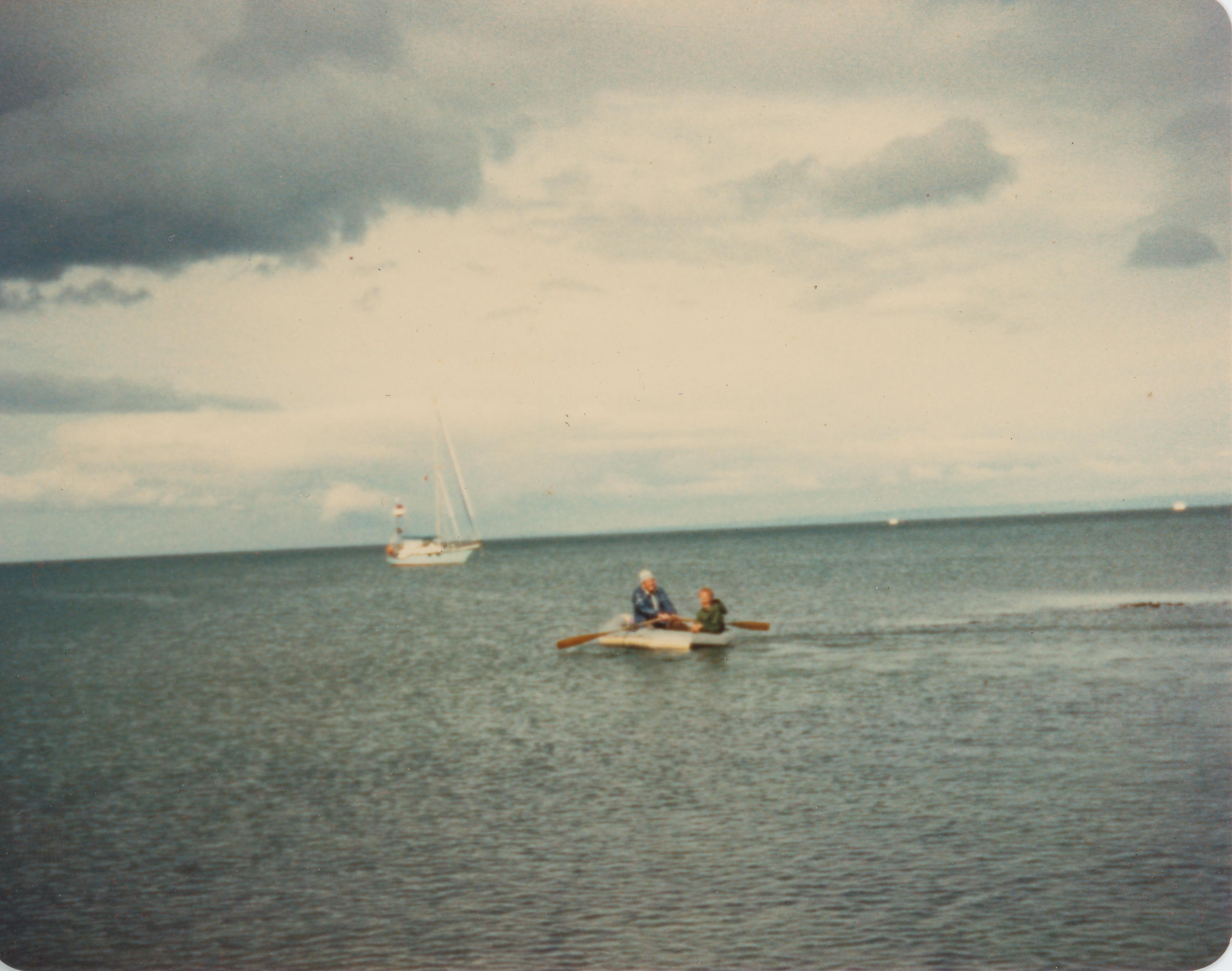 Photograph Inflatable dinghy in bay New Zealand Maritime Museum