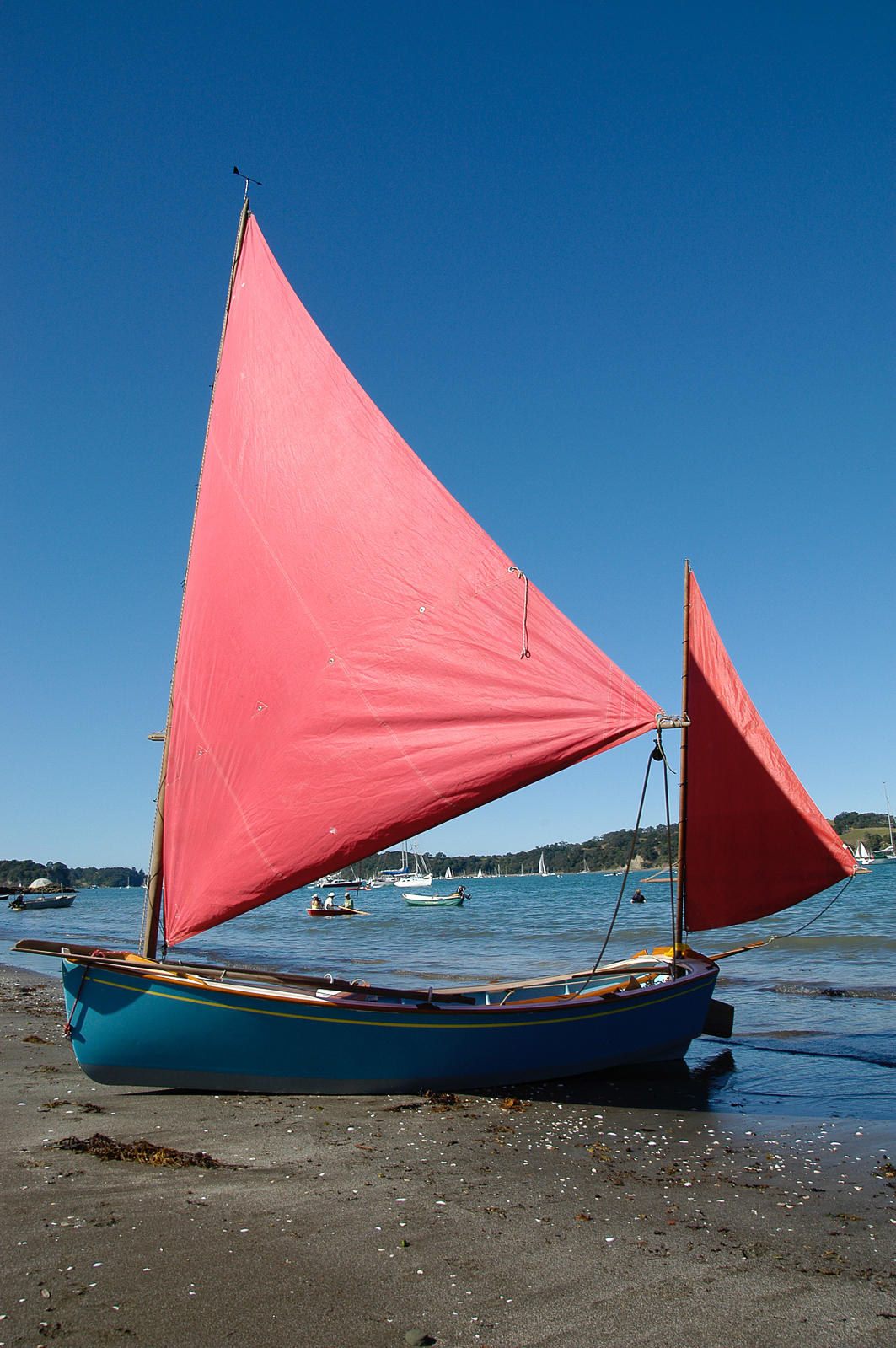 Photograph Sailing dinghy pulled up on beach, [Sullivan's Bay