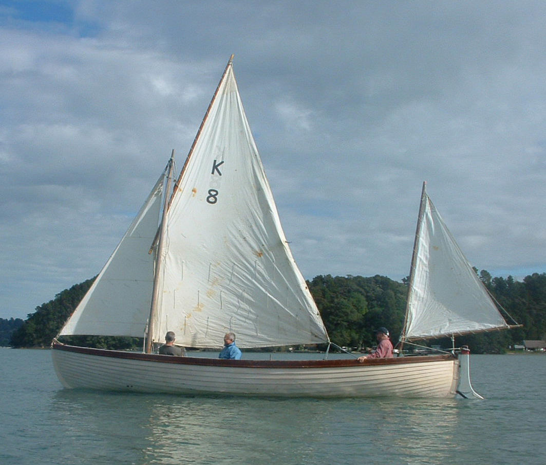 Photograph Cutter yacht K8 with three people onboard New Zealand